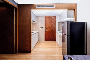 Fridge, microwave, stovetop, dining tables