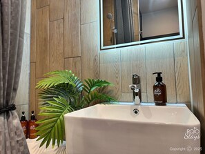 Hair dryer, towels, soap, shampoo