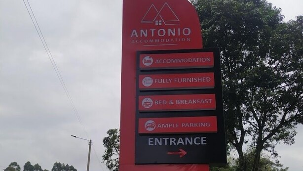 A sign for Antonio Accommodation with amenities including fully furnished rooms, bed & breakfast, and ample parking. - Antonio Accommodation Kericho (Kericho)