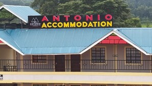 A two-story building with a sign reading "Antonio Accommodation" and a blue roof. - Antonio Accommodation Kericho (Kericho)