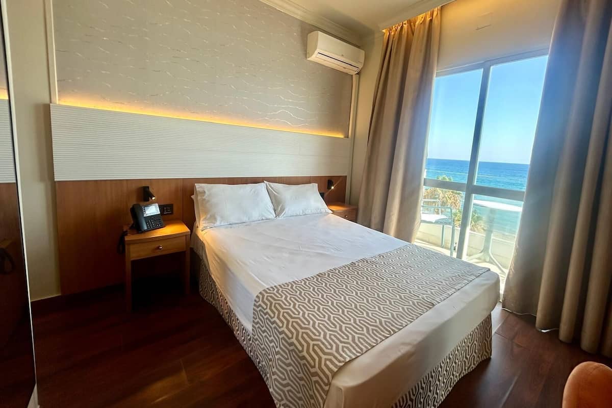 Single Room, Balcony, Sea View | Minibar, in-room safe, desk, laptop workspace