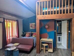 A room with a bunk bed, a sofa, a small desk, and a window with curtains. - Guest Rooms – Château at lesoleilo.com with Shared Pool from 12/06 to 13/09/2026 (Mostuéjouls)