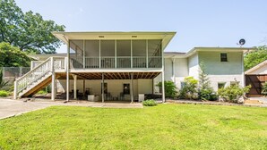 A two-story house with a covered porch and a staircase leading to the upper level. - 2617 Caladium Drive NE, Atlanta (Atlanta)