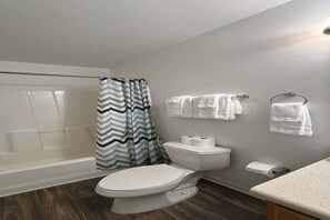 Shower, hair dryer, towels, shampoo