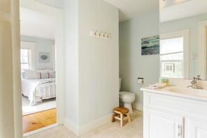 Shower, hair dryer, towels, toilet paper