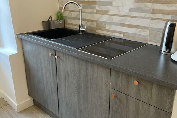 Fridge, microwave, stovetop, coffee/tea maker