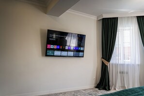 In-room safe, laptop workspace, blackout drapes, soundproofing