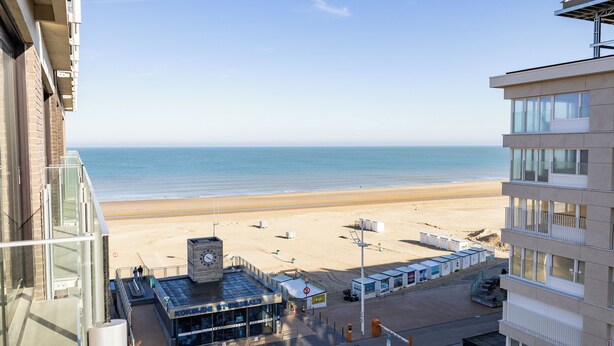 A hotel with a view of the beach and ocean. It has a modern design with large windows and a flat roof. - 1 bedroom accommodation in Sint Idesbald (Sint Idesbald)