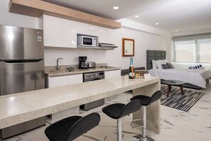 Fridge, microwave, stovetop, coffee/tea maker