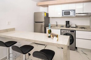 Fridge, microwave, stovetop, coffee/tea maker