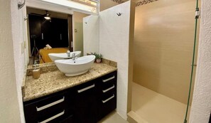 Shower, hair dryer, towels, shampoo