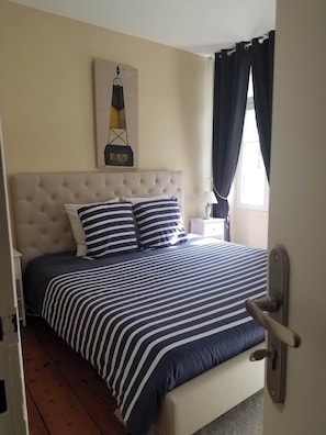 Laptop workspace, blackout drapes, soundproofing, iron/ironing board