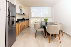 Fridge, microwave, stovetop, cookware/dishes/utensils