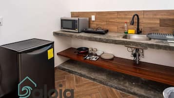 Microwave, stovetop, cookware/dishes/utensils