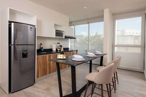 Fridge, microwave, stovetop, coffee/tea maker
