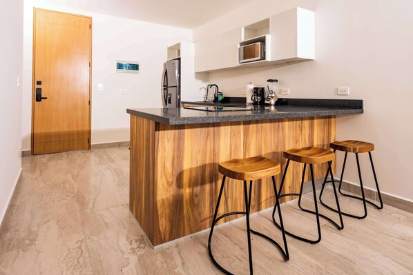 Fridge, microwave, stovetop, coffee/tea maker