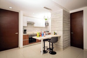 Fridge, microwave, stovetop, coffee/tea maker