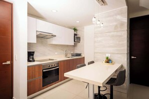 Fridge, microwave, stovetop, coffee/tea maker