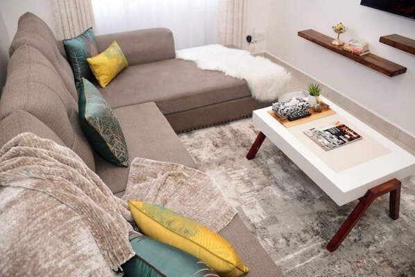 Living area - Zoya-1 Bed/rm, Deluxe+Home Office near JKI Airport (Nairobi)