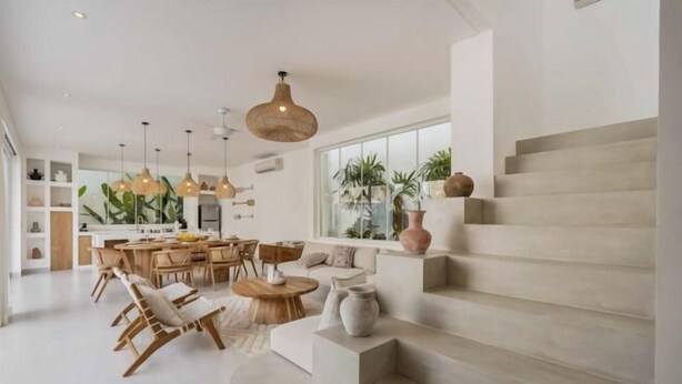 A modern interior with a staircase, dining area, and kitchen. - Villa Las Casas 2 by BaliSuperHost (Bali)