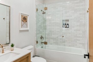 Deluxe Studio | Bathroom | Hair dryer, slippers, towels