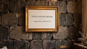A framed sign on a stone wall indicating the 'Venus Stone Room' with an original Roman Wall from 305 AD. - Silver Gate Rooms-Diocletian's Palace - Twin Room (Split)