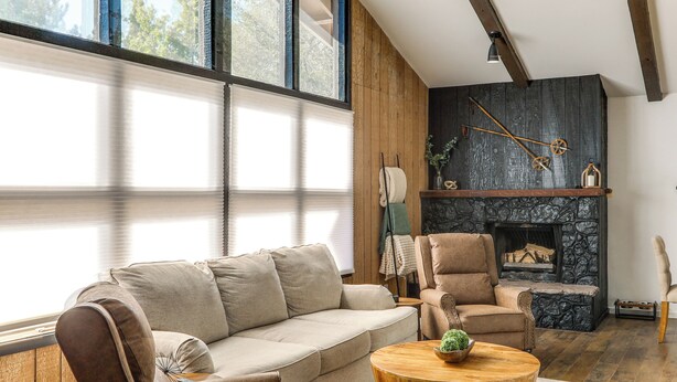 A modern living room with a sofa, armchairs, a fireplace, and a large window. - 'The High Country Hideaway' Flagstaff Golf Retreat (Flagstaff)