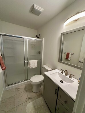 Shower, hair dryer, towels, soap