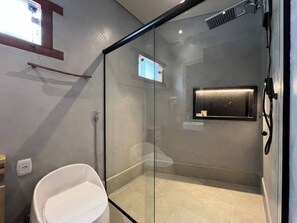 Shower, towels, soap, toilet paper