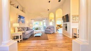 TV, fireplace, books - "Captain's Key Waterside Retreat" Boat Dock! Awesome Pool! (Palm Coast)