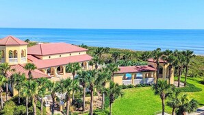 A large resort with multiple buildings, palm trees, and a view of the ocean. - 🌅"Surfclub Retreat"🌴6th Floor Penthouse Corner! Wraparound Balcony! Ocean Views!🏖️ (Palm Coast)