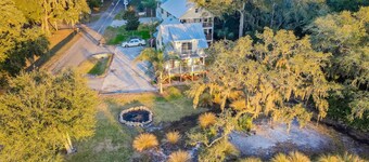 Inviting waterfront cottage with balcony, firepit, marsh views, & washer/dryer