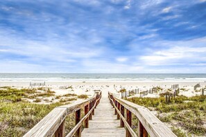 A wooden boardwalk leading to a beach with sand dunes and a clear sky. - Spacious Beachfront Home w/Deck, Balcony, Central A/C, Washer/Dryer, and WiFi (Fernandina Beach)