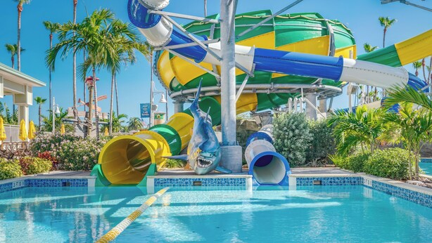 A water park with multiple slides and a pool area.