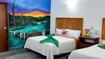 عناصر مجانية داخل الميني بار ومكتب وواي فاي مجانًا وملاءات أسرّة