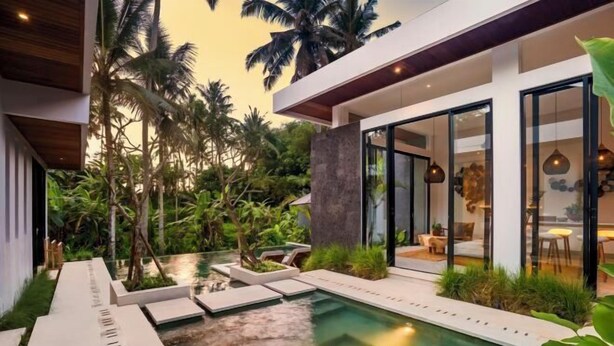 A modern house with a swimming pool, large glass doors, and tropical plants. - Villa Ornella by BaliSuperHost (Bali)