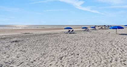 Spacious home with sunroom, patio, fireplace, & water views