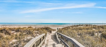 Oceanfront condo with direct beach access, pool, balcony, grilling area, & AC