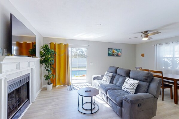 TV, fireplace, books