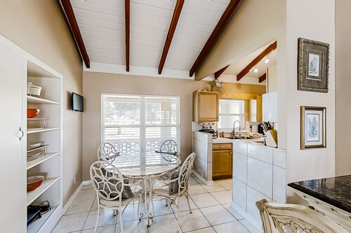 Home near the beach & golf with inviting patio, fireplace, AC, & washer/dryer