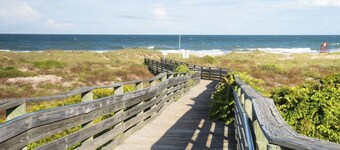 Home near the beach & golf with inviting patio, fireplace, AC, & washer/dryer