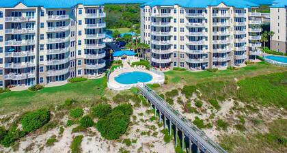 Luxurious oceanfront condo with private balcony, 2 pools, and beach access
