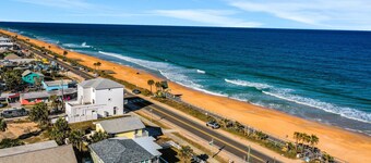 Updated home across from beach with covered balcony, central AC, & washer/dryer