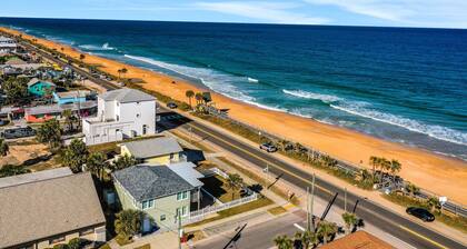 Updated home across from beach with covered balcony, central AC, & washer/dryer