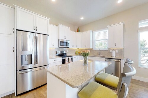 Stylish brand-new ocean view home with deck & porch - steps to beach