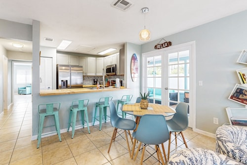 Water-view dog-friendly home with outdoor space & entertainment options