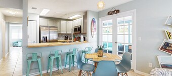 Water-view dog-friendly home with outdoor space & entertainment options