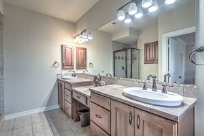 A modern bathroom with two sinks, wooden cabinets, a large mirror, and a shower area. - NEW! 3 BDRM Condo I Lake Views/Marina I Mins To DT (Austin)