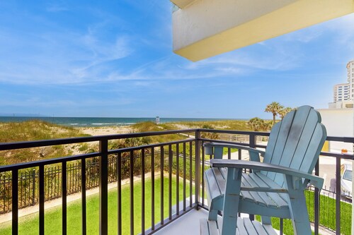 Modern oceanfront condo with outdoor pool, balcony, & washer/dryer