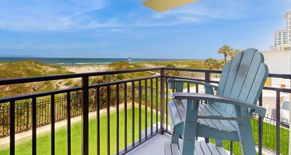 Modern oceanfront condo with outdoor pool, balcony, & washer/dryer